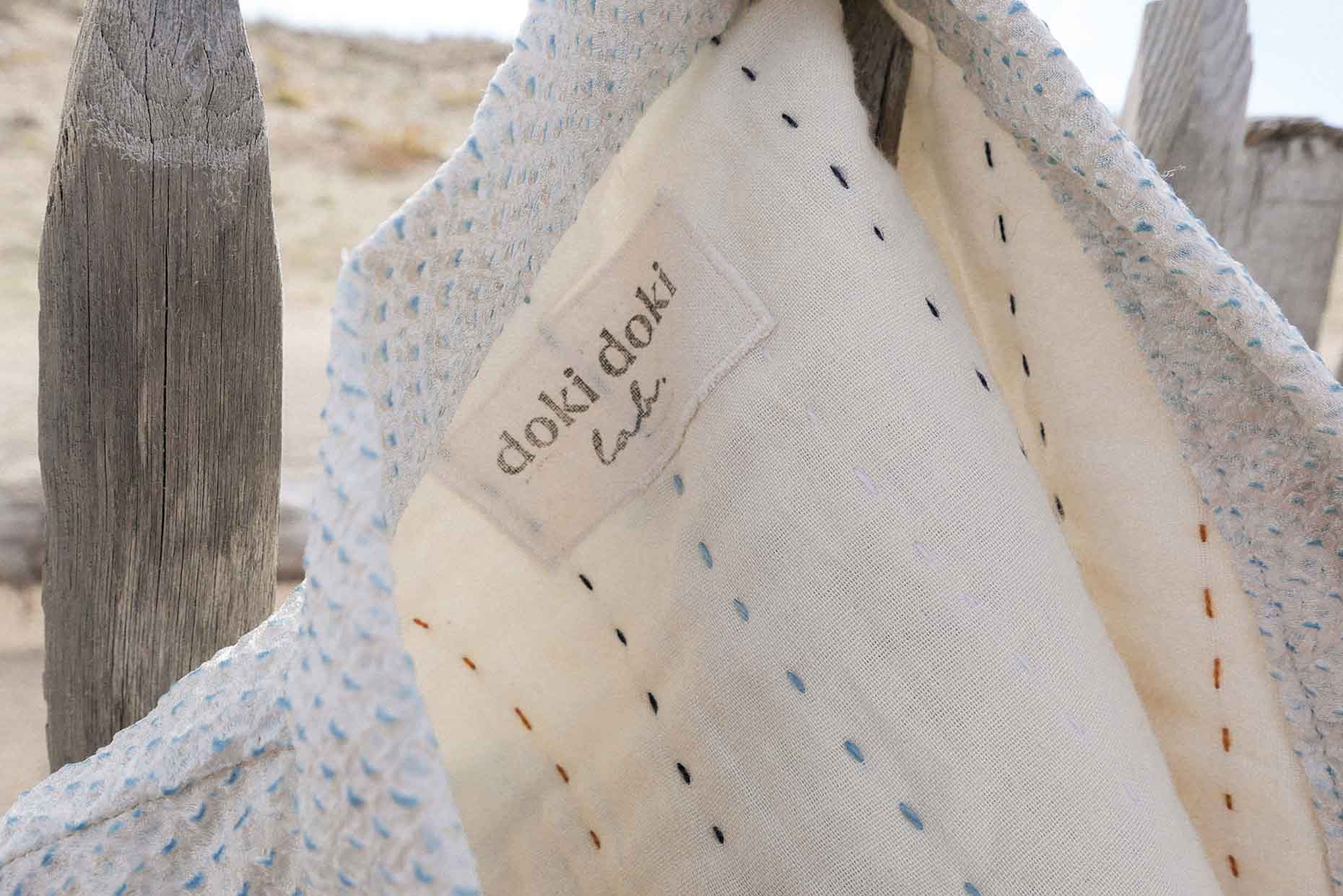 hand-stitched and stamped label